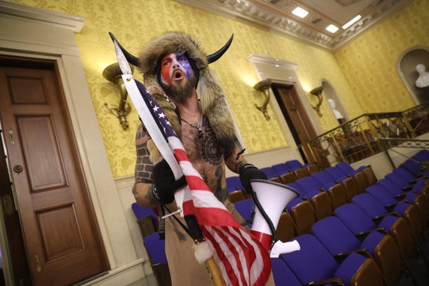 "QAnon Shaman" inside Senate Chamber 