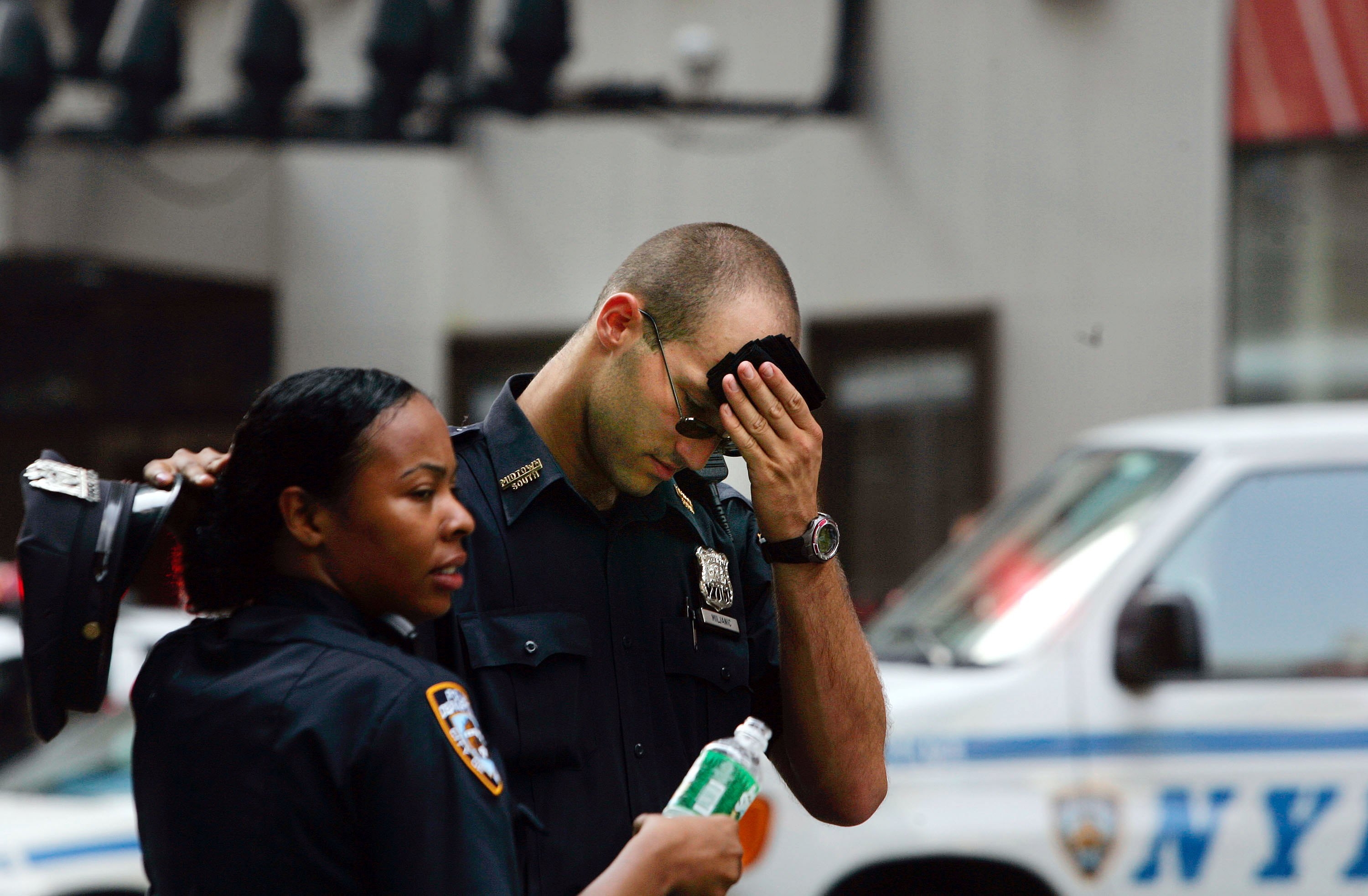 NYPD Officers Bake In NYC Heat/Getty Images 