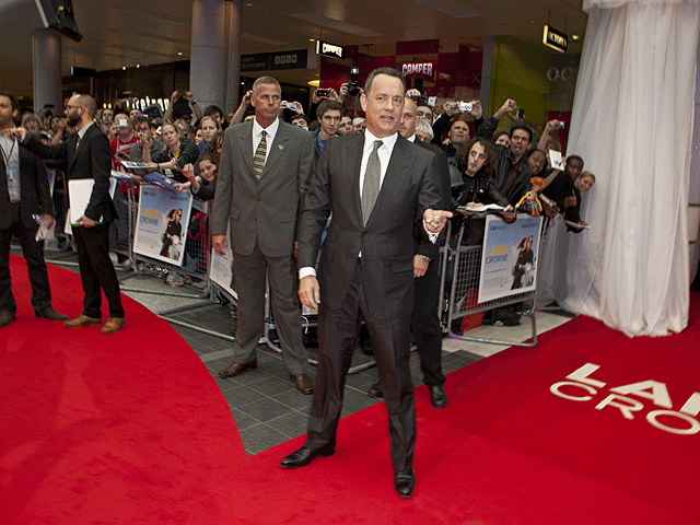 014-prem-om-hanks-on-carpet.gif 