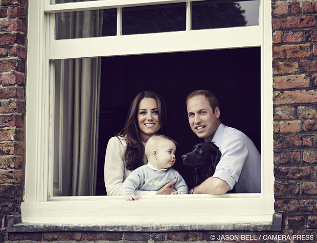 Prince William, Duke of Cambridge, Catherine, Duchess of Cambridge, and Prince George of Cambridge pose for an official family portrait at Kensington Palace ahead of their tour to Australia and New Zealand March 18, 2014, in London. Also pictured is their 