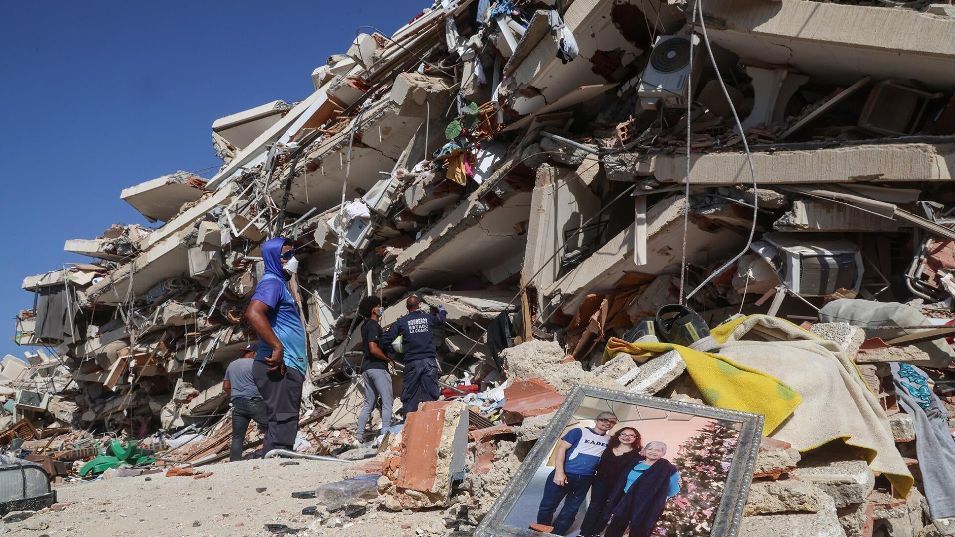 Videos show U.S. rescue team pull mother, baby from rubble in Venezuela