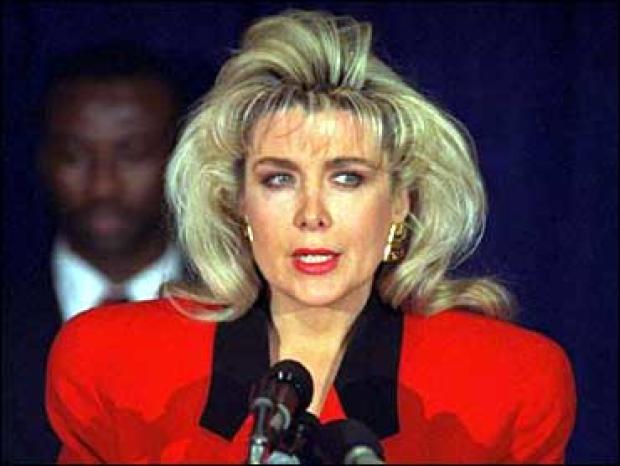 Gennifer Flowers speaks to the press about her claim of a 12-year affair with then-Democratic presidential hopeful Bill Clinton during a news conference in New York Jan. 27, 1992. 