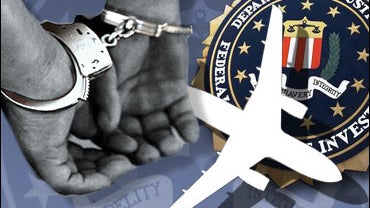 Customs officers stand guard near seized rhino horns  