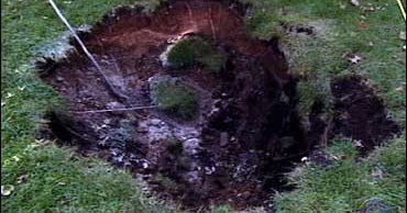 Danger Lurking Under The Backyard? CBS News