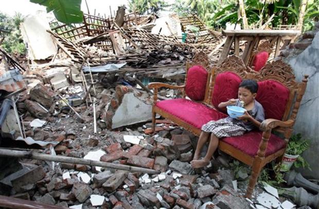 young earthquake victim eats breakfast 