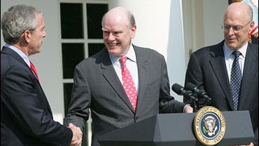 President Bush, John Snow, and Henry M. Paulson 
