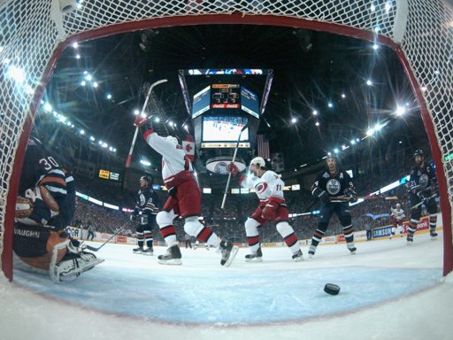 Rod Brind'Amour #17 and Justin Williams #11 of the Carolina Hurricanes celebrate 
