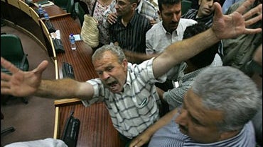 Palestinian civil servant shouts 