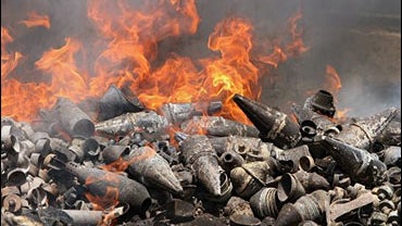 Palestinian rockets burn after an Israeli airstrike 