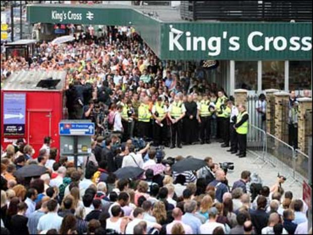 A two minute's silence is observed at King's Cross station, London 