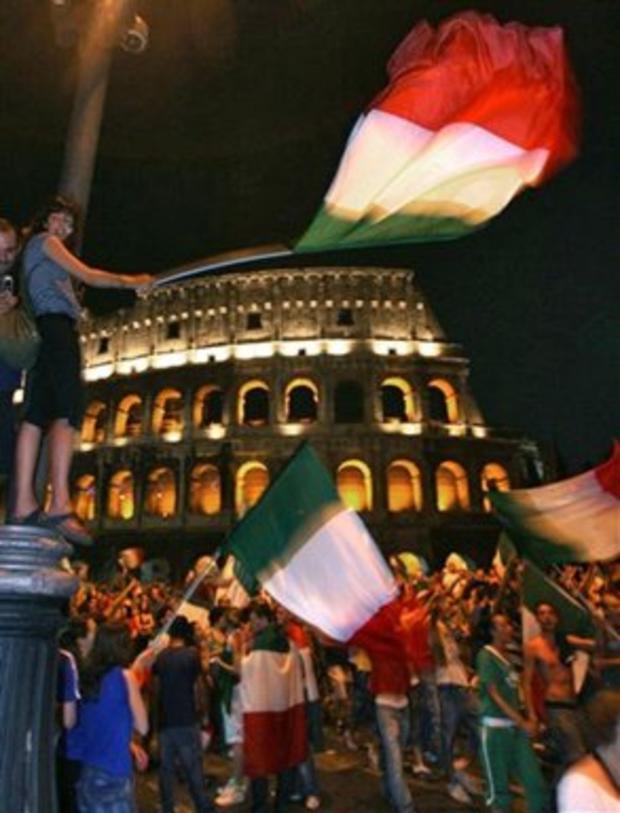 Italian soccer fans gather at Rome's ancient Colosseum 