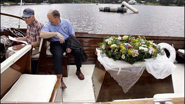 Charlie Adams, left, the pilot, and the Rev. Richard McCaughy 