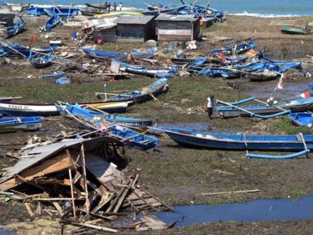 Destroyed fishing boats are seen after a tsunami swept past the beach in Kebumen, Central Java, Indonesia 