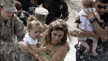 An Israeli heavy artillery piece fires towards targets in southern Lebanon near Kiryat Shmona 