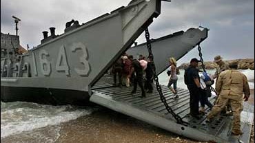 Americans board a Navy landing craft north of Beirut 