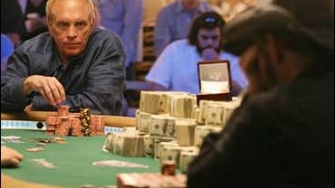 David "Chip" Reese gathers a bet during the heads-up play of the $50,000 buy-in H.O.R.S.E. tournament against Andy Bloch 