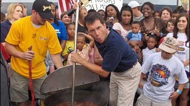 <b>Dave Price</b> stirs a pot of some sensational Jambalaya with Andy Fontenot of the Jambalaya Shop lookign on, July 26, 2006, in Baton Rouge, La. 