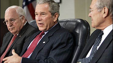 Secretary of Defense Donald Rumsfeld, right, and Vice President Dick Cheney, left, look on as President Bush 
