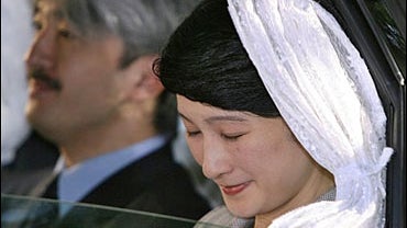 Japan's Princess Kiko, accompanied by her husband, Prince Akishino, arrives at a Tokyo hospital 