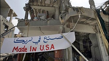 An anti-United States banner decorates the rubble of a building destroyed during the month-long Israeli offensive against Hezbollah 