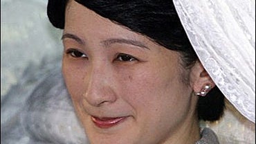 Japan's Princess Kiko, wife of Emperor Akihito's second son Prince Akishino, beams as she arrives at a Tokyo hospital 
