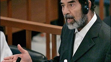 Former Iraqi president Saddam Hussein addresses the court on the second day of the trial 