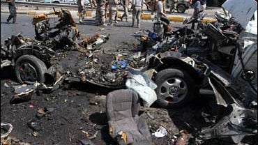 The wreckage of a minibus destroyed in Baghdad 