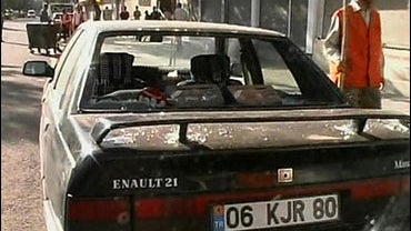 Damaged car near scene of bomb blast, Digarbakir, Turkey 