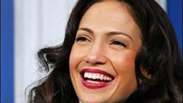 Jennifer Lopez laughs at a news conference for "El Cantante" during the Toronto International Film Festival in Toronto, Wednesday, Sept. 13, 2006. (AP Photo/CP, Aaron Harris) 