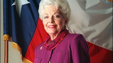 Texas Gov. Anne Richards stands in front of the Texas state flag at the July 1992 Democratic National Convention in New York. 