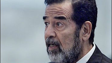Former Iraqi President Saddam Hussein testifies during his trial on genocide charges 