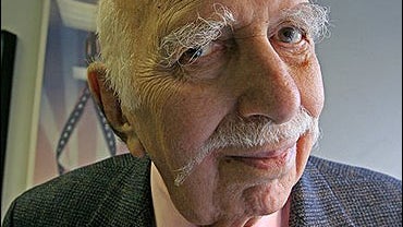 David Brown, poses for a photograph in his office in New York 