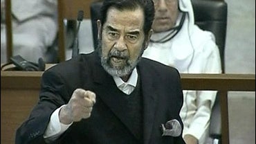 Saddam Hussein, former Iraqi president, argues with new chief judge during his trial for genocide, Baghdad, Iraq, Sept. 20, 2006. 