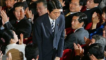 Shinzo Abe bows as he acknowledges applause from the Liberal Democratic Party (LDP) lawmakers upon winning a landslide victory Sept. 20, 2006 in Japan's ruling party presidential vote at the LDP headquarters in Tokyo. 