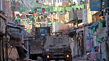 A forest firefighter turns away to protect himself from the intense heat as the Day Fire, jumps Lockwood Valley road in Ventura, Calif. 
