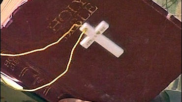 Holy bible held by military chaplain 