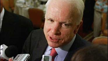 U.S. Sen. John McCain, R-Ariz, right, talks to reporters after a campaign appearance for U.S. Sen Lincoln Chafee, R- R.I., left, Wednesday, Oct. 4, 2006, in Providence, R.I. McCain called Wednesday for Congressional leaders to appoint a panel of "credible 