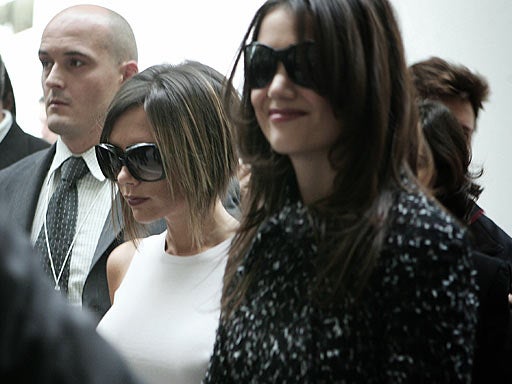 Victoria Beckham (L) and Katie Holmes (R) 