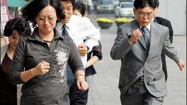 Pedestrians rush to a shelter during civil defense drill in Seoul 