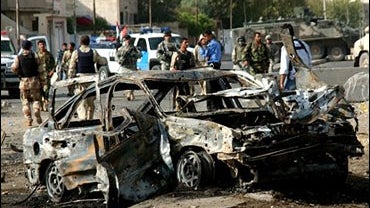 Iraqi police officers secure the area in Mosul, 360 kilometers (225 miles) northwest of Baghdad 