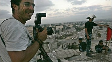 Associated Press photographer and Spanish national Emilio Morenatti, 37, is seen working in Gaza 