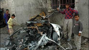 kids at car bomb site 
