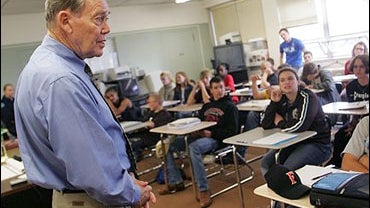 Sen. Craig Thomas, R-Wyo., left, answers a student's question in a government class at Cheyenne East High School in Cheyenne 