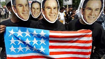 Indonesian activists from an Islamic group protest George W. Bush 