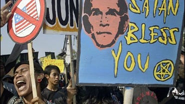 Indonesian students protest against U.S. President George W. Bush in front of the U.S. Embassy Monday, Nov. 20, 2006, in Jakarta, Indonesia. 