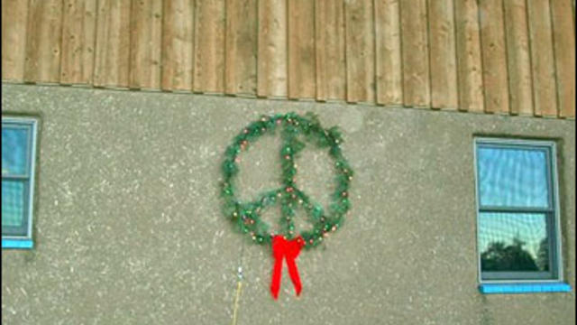 Pagosa Springs Colorado homeowners are battling over whether a Christmas wreath that includes a peace sign is an anti-Iraq war protest or even a promotion of Satan. 