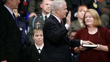President Bush, left, looks on as Robert Gates, is sworn in as the new defense secretary at the Pentagon, Monday, Dec. 18, 2006. 