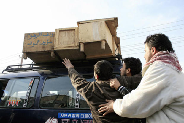 Coffins Punctuate Iraq Blast 