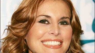 Model Niki Taylor smiles as she launches her new fragrance, "Begin," Oct. 14, 2005, in New York. 