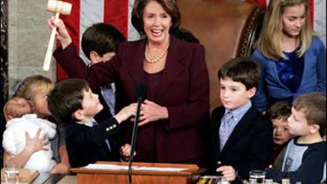 Speaker of the House Nancy Pelosi holds up the gavel 